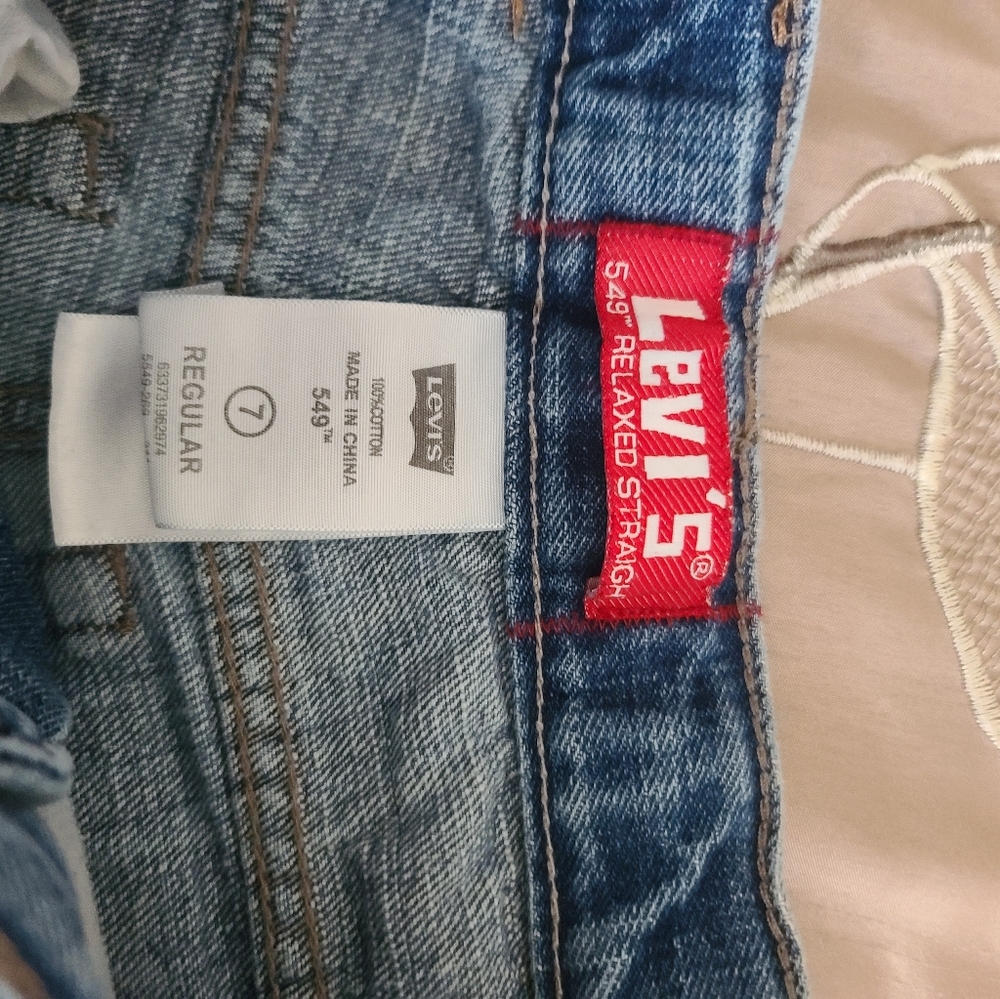 Boys Levi's. Size 7. Tears in the knees and green tint. Play time jeans